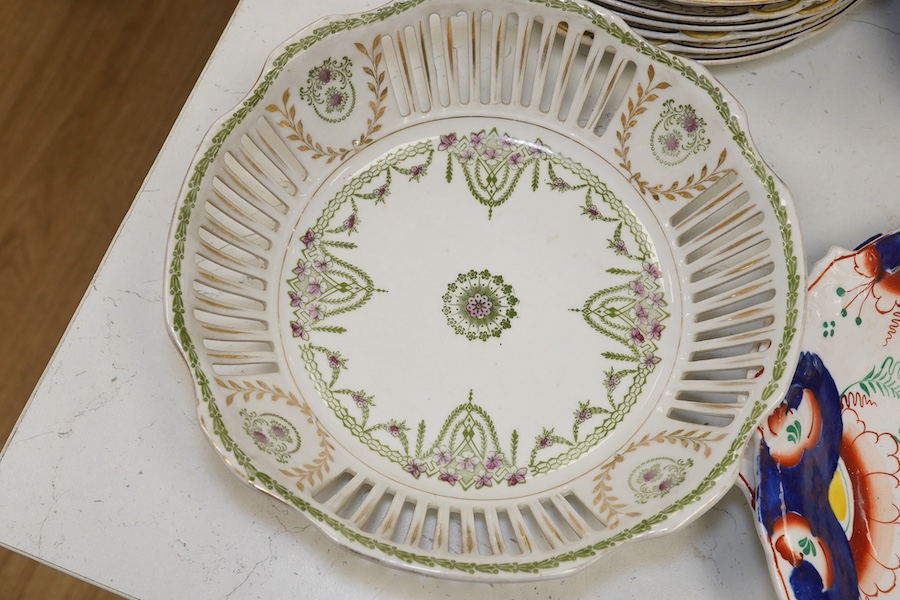 Ten French Luneville floral plates, a hand painted basket edged plate and various part dinner service plates, 24cm in diameter. Condition - mostly fair to good